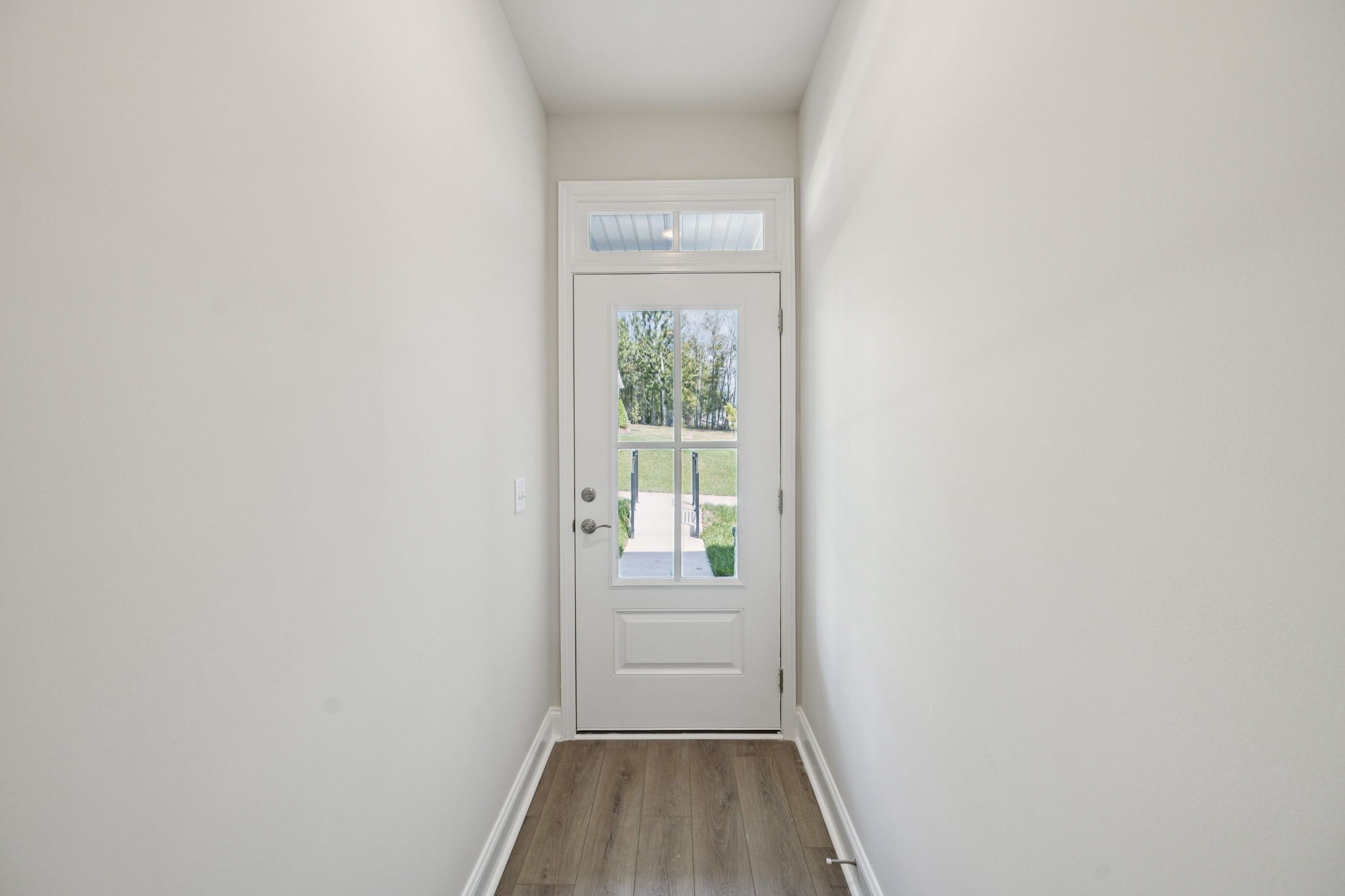 8152 Rocky Fork Almaville Road Smyrna, TN 37167 - Photo 7 of 43 a view of a hallway with wooden floor and a window