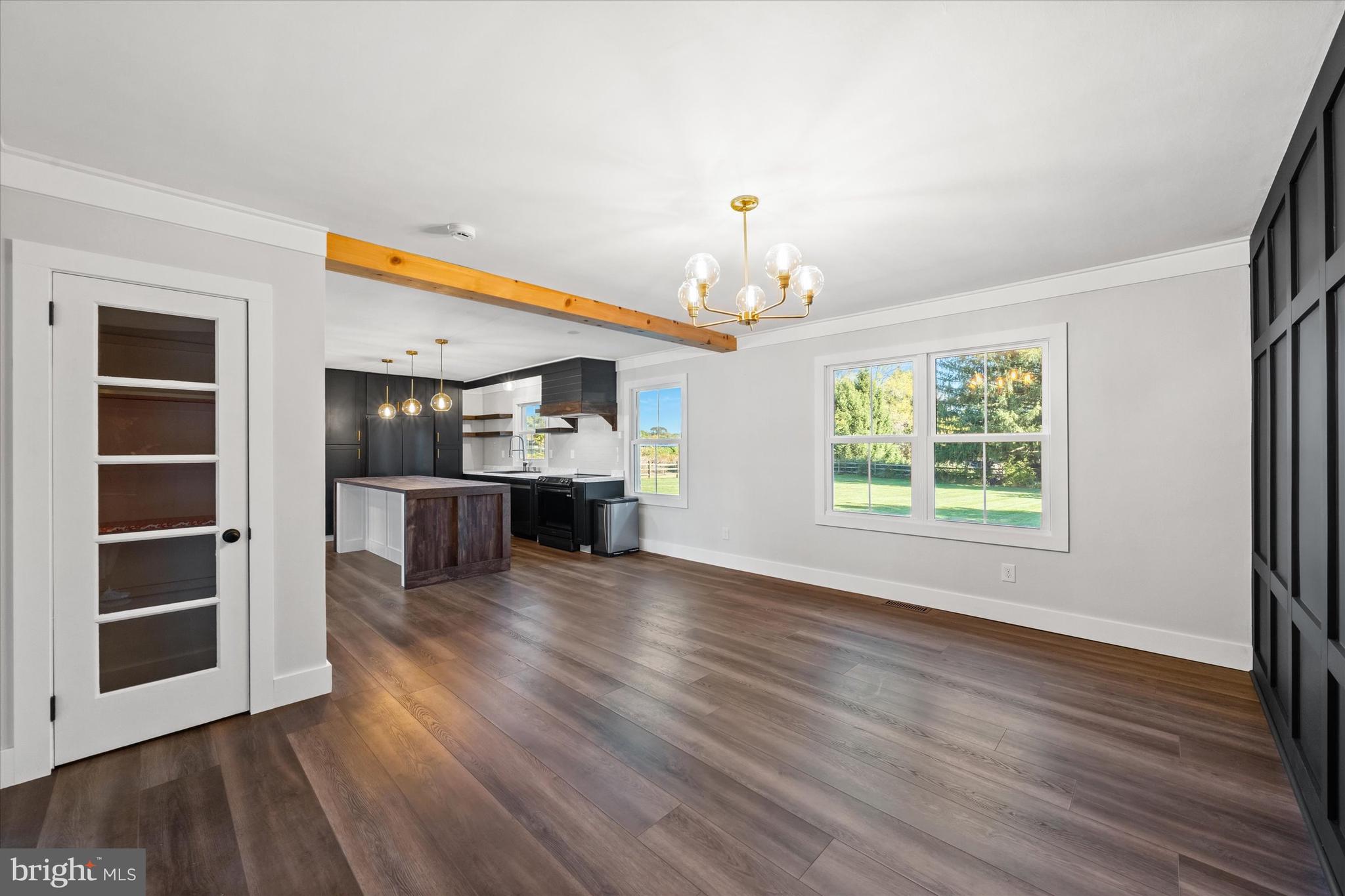108 Evanson Road Hockessin, DE 19707 - Photo 19 of 49 a view of a livingroom with wooden floor closet and windows