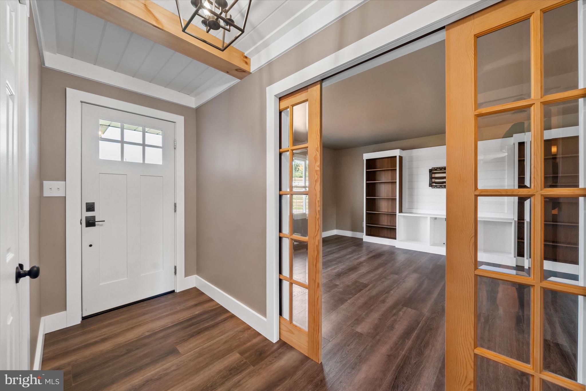108 Evanson Road Hockessin, DE 19707 - Photo 20 of 49 wooden floor in an empty room with a window