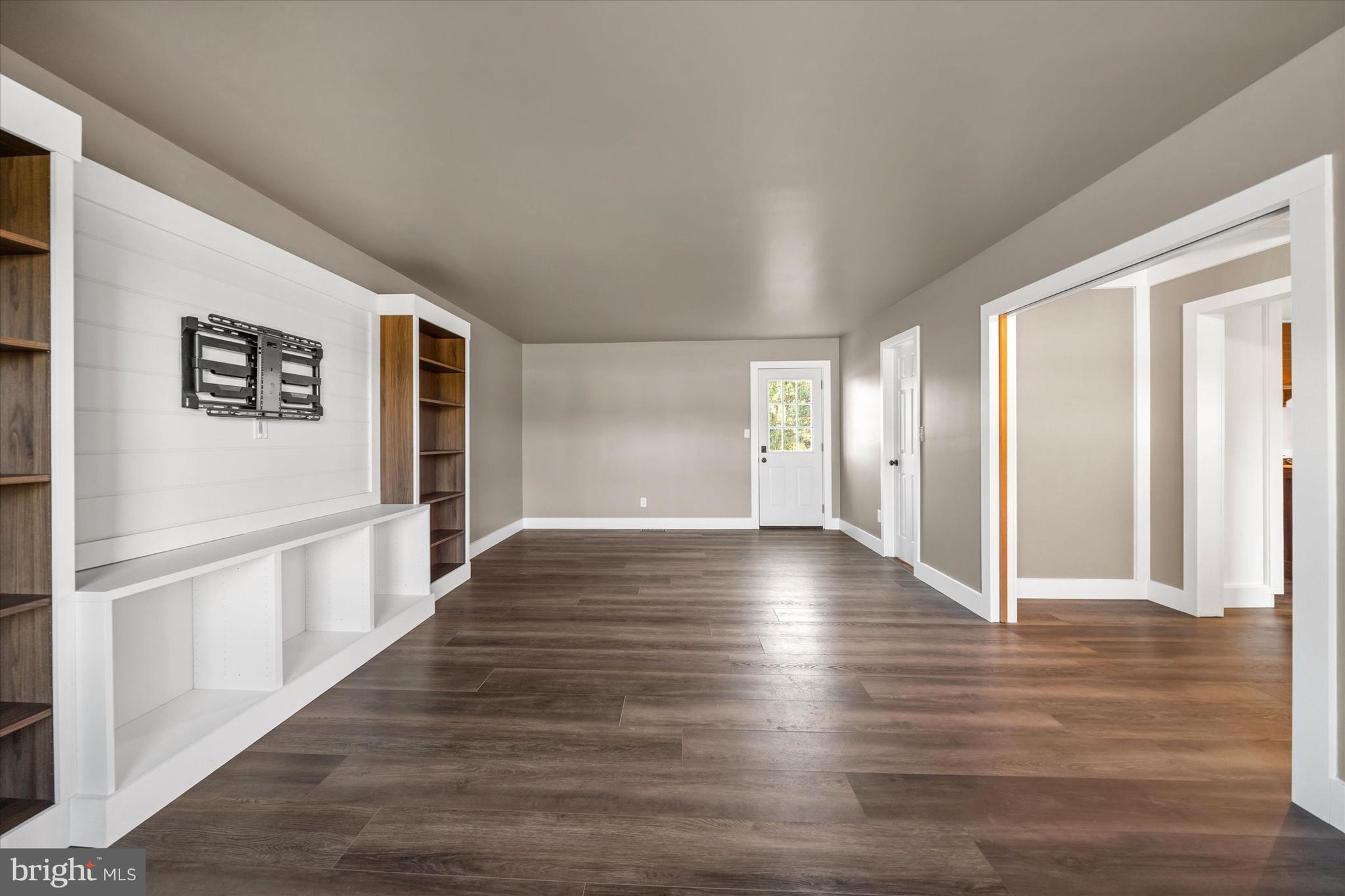 108 Evanson Road Hockessin, DE 19707 - Photo 21 of 49 a view of a hallway with wooden floor