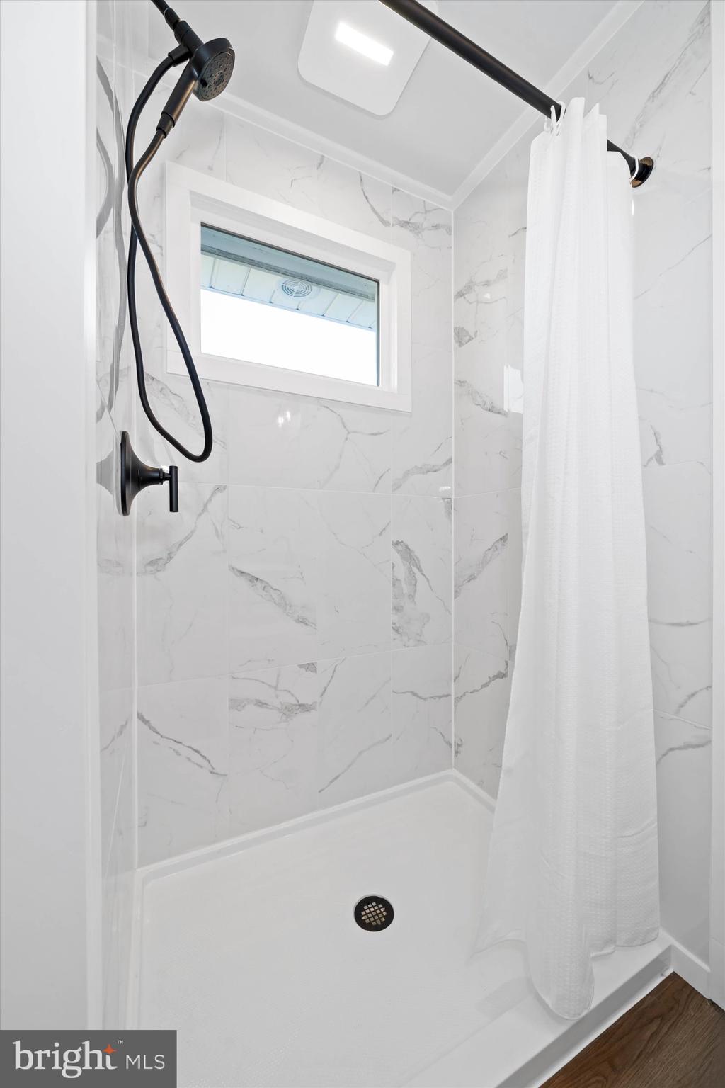 108 Evanson Road Hockessin, DE 19707 - Photo 24 of 49 a bathroom with a bath tub with a shower