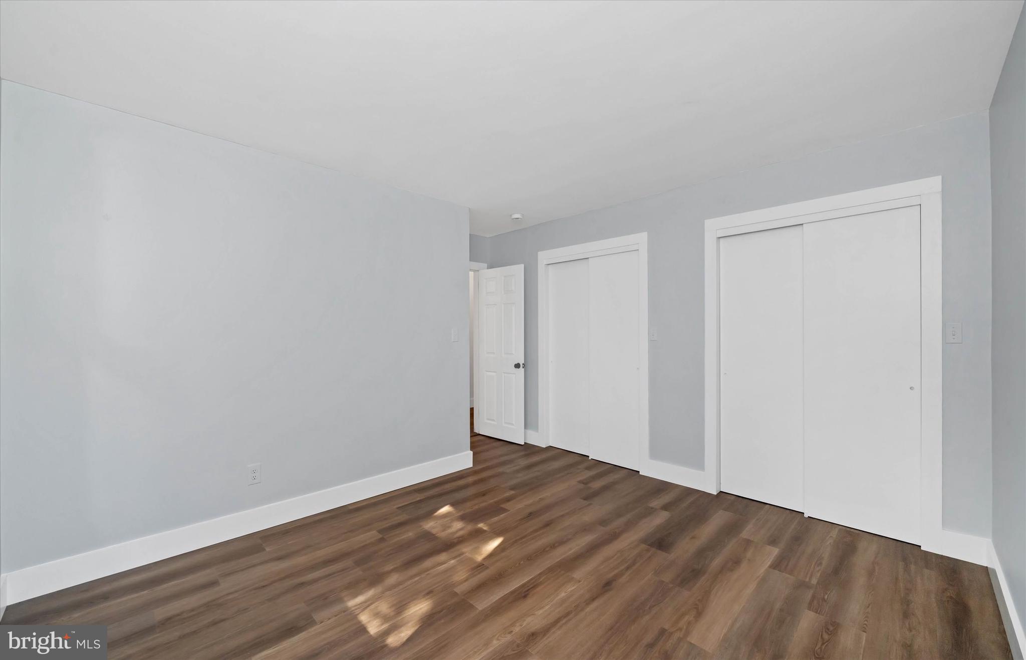 108 Evanson Road Hockessin, DE 19707 - Photo 31 of 49 a view of empty room with wooden floor