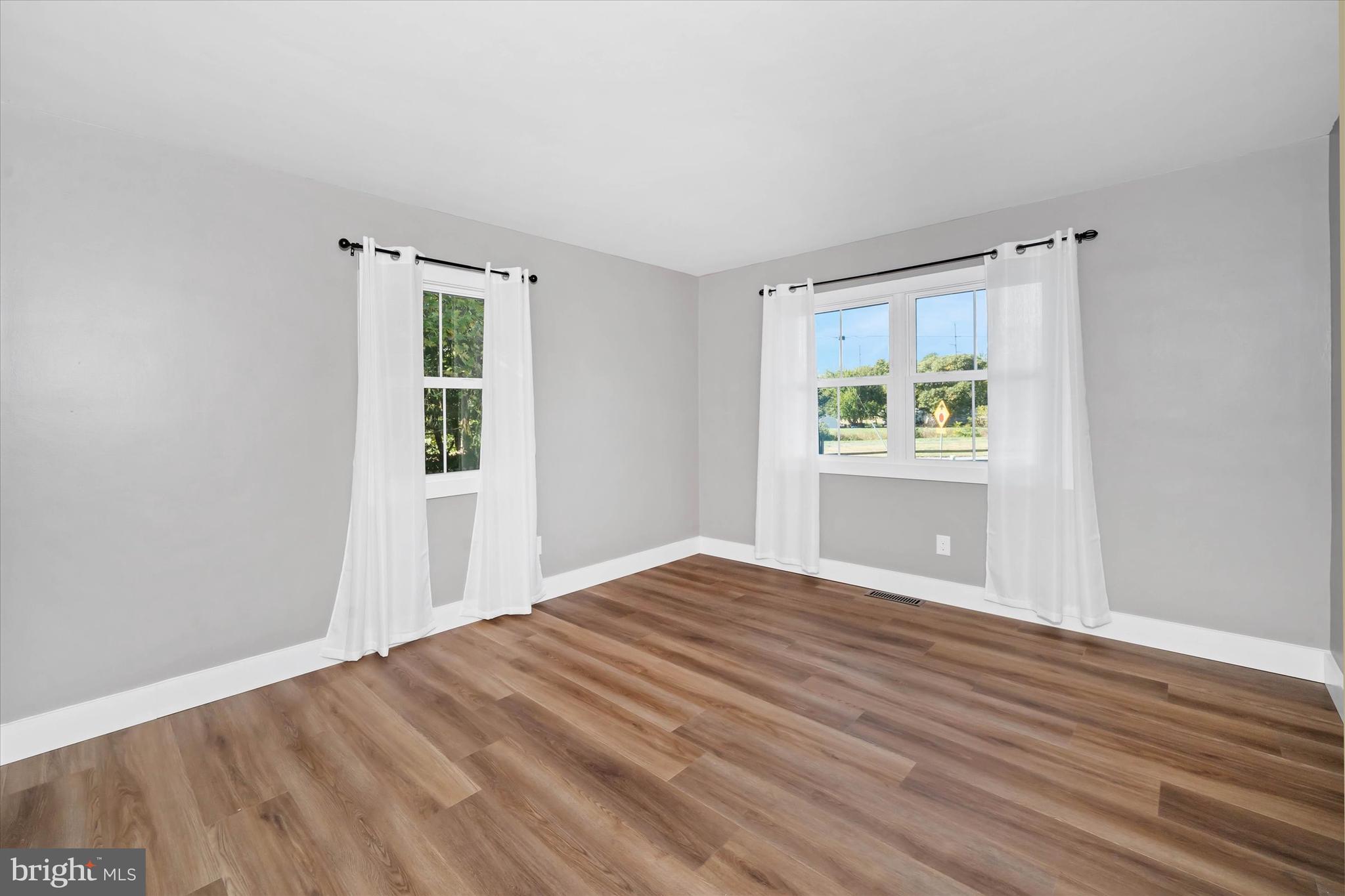 108 Evanson Road Hockessin, DE 19707 - Photo 34 of 49 a view of empty room with wooden floor and fan