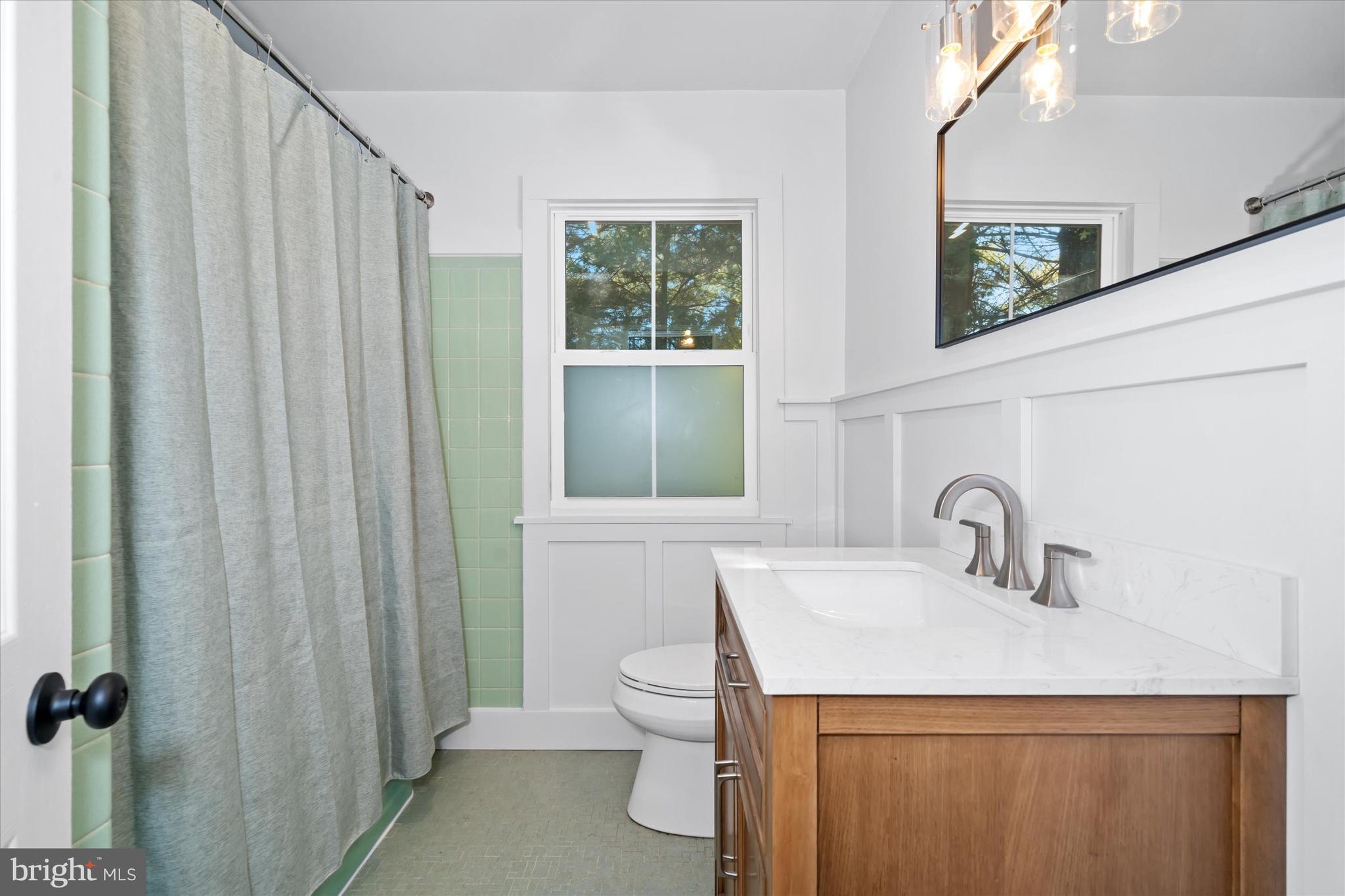 108 Evanson Road Hockessin, DE 19707 - Photo 36 of 49 a bathroom with a sink a toilet and shower