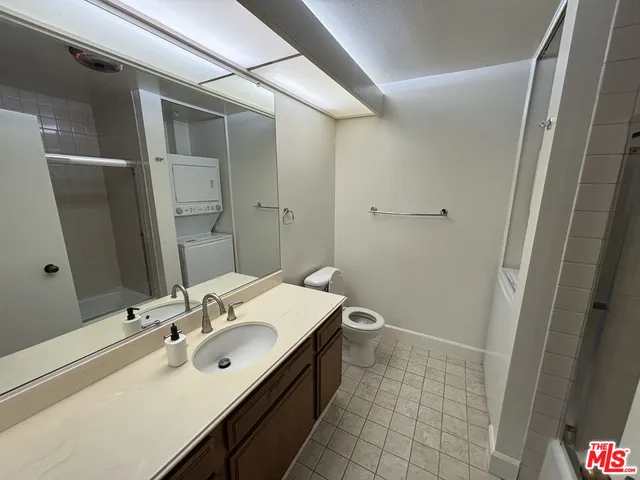 a bathroom with a sink a toilet and vanity