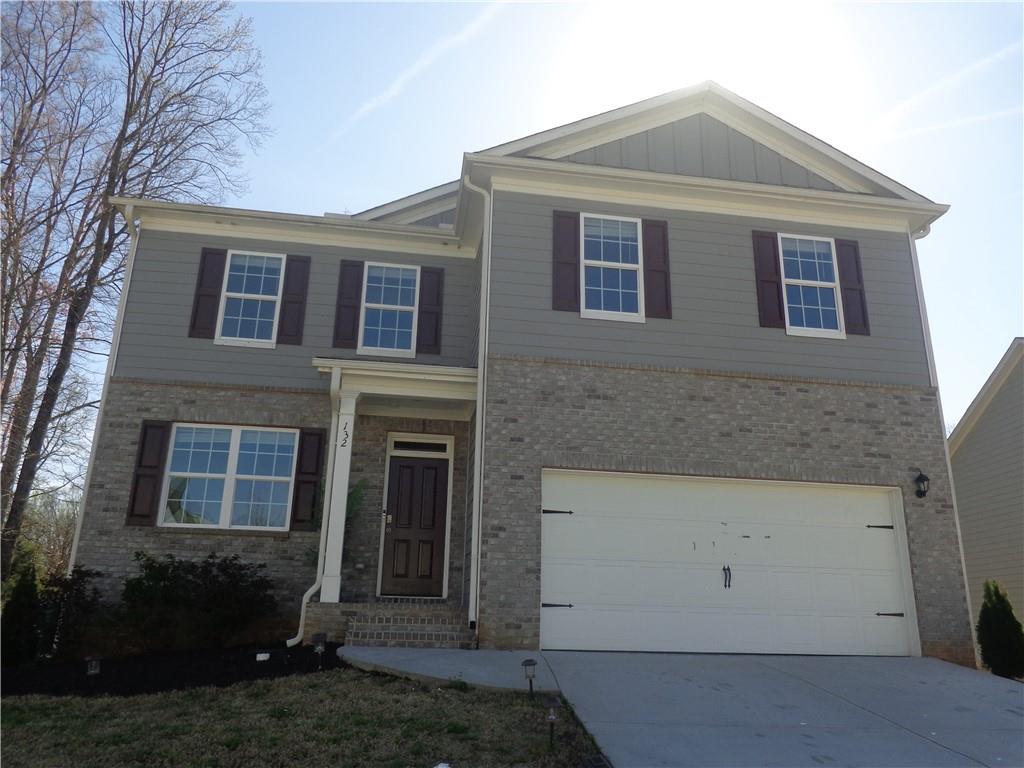 132 Russell Road Pendergrass, GA 30567 - Photo 1 of 50 a front view of a house with a yard