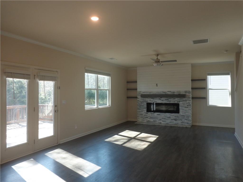 132 Russell Road Pendergrass, GA 30567 - Photo 11 of 50 a living room with furniture and a fireplace