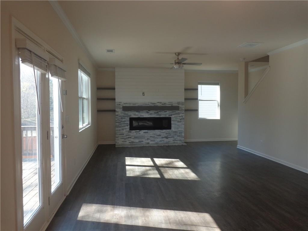 132 Russell Road Pendergrass, GA 30567 - Photo 12 of 50 a living room with a fireplace and a window