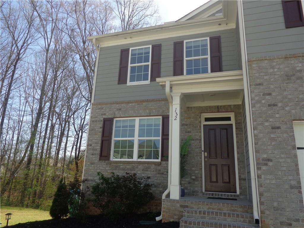 132 Russell Road Pendergrass, GA 30567 - Photo 2 of 50 a front view of a house with a yard