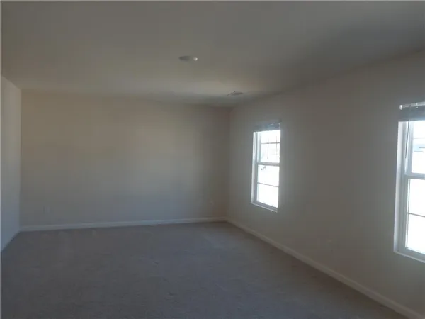 an empty room that has a window