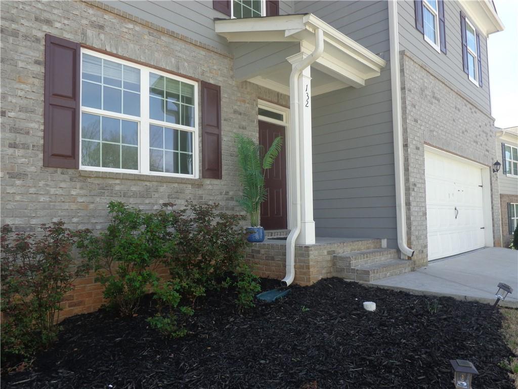 132 Russell Road Pendergrass, GA 30567 - Photo 3 of 50 a view of front door and porch