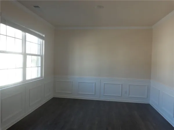 an empty room with a empty space and window