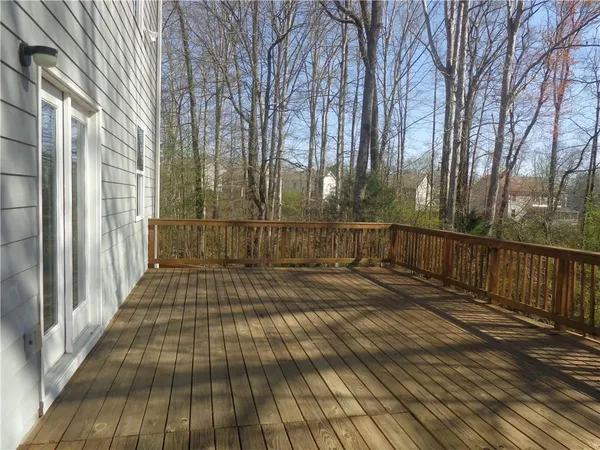 a view of a pathway with a wrought fence