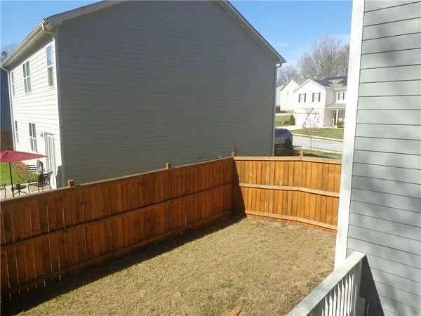 a view of balcony with yard
