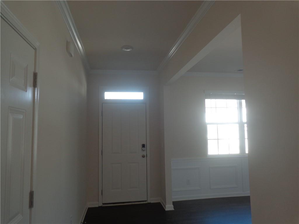 132 Russell Road Pendergrass, GA 30567 - Photo 7 of 50 a view of an empty room with wooden floor and a window
