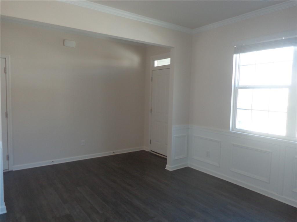 132 Russell Road Pendergrass, GA 30567 - Photo 8 of 50 an empty room with wooden floor and windows