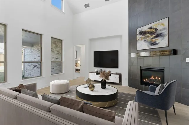 a living room with furniture and a fireplace