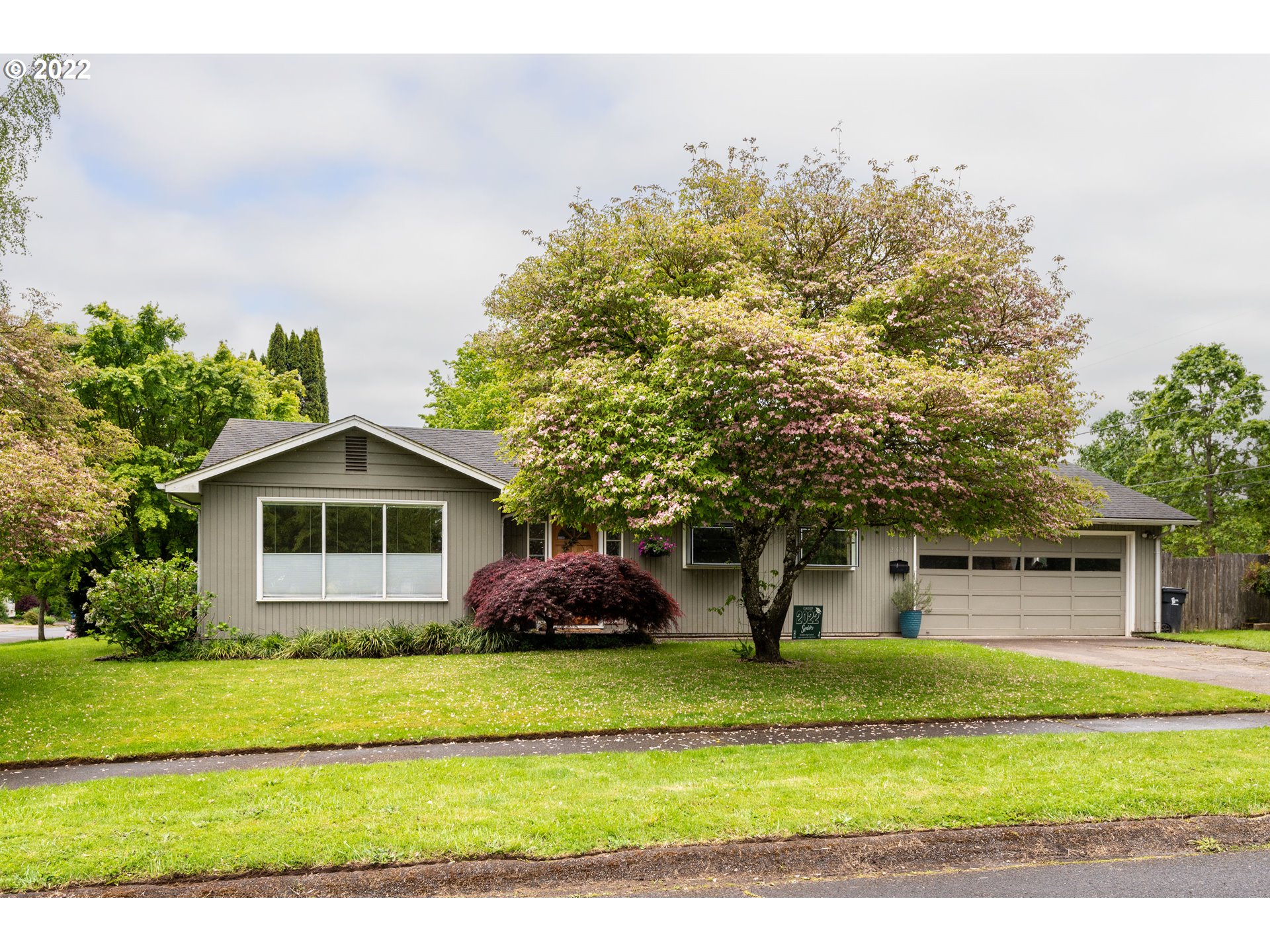 2390 Frontier Drive Eugene, OR 97401 - Photo 1 of 32 a front view of a house with a yard