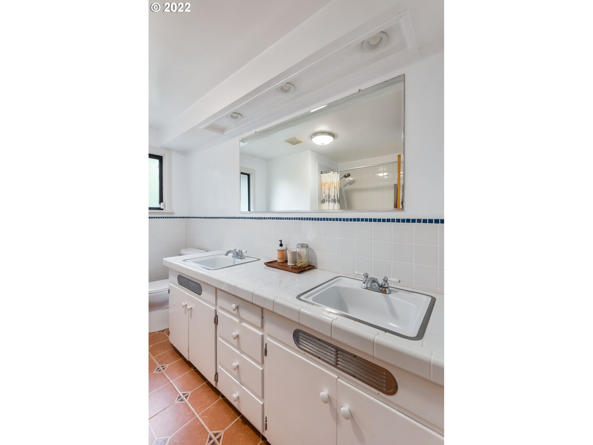 2390 Frontier Drive Eugene, OR 97401 - Photo 11 of 32 a bathroom with a sink and a mirror
