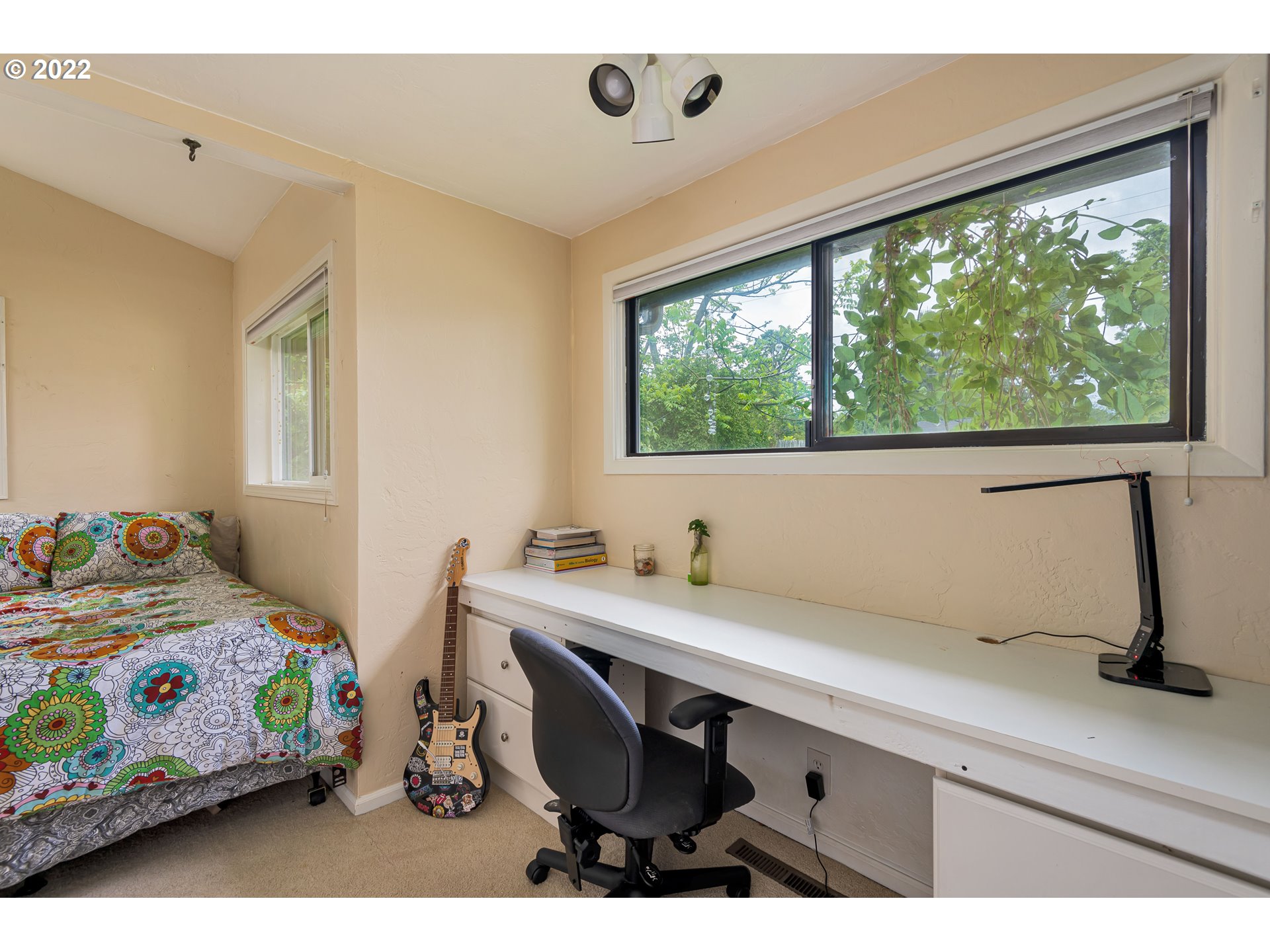2390 Frontier Drive Eugene, OR 97401 - Photo 19 of 32 a bedroom with a bed and a window