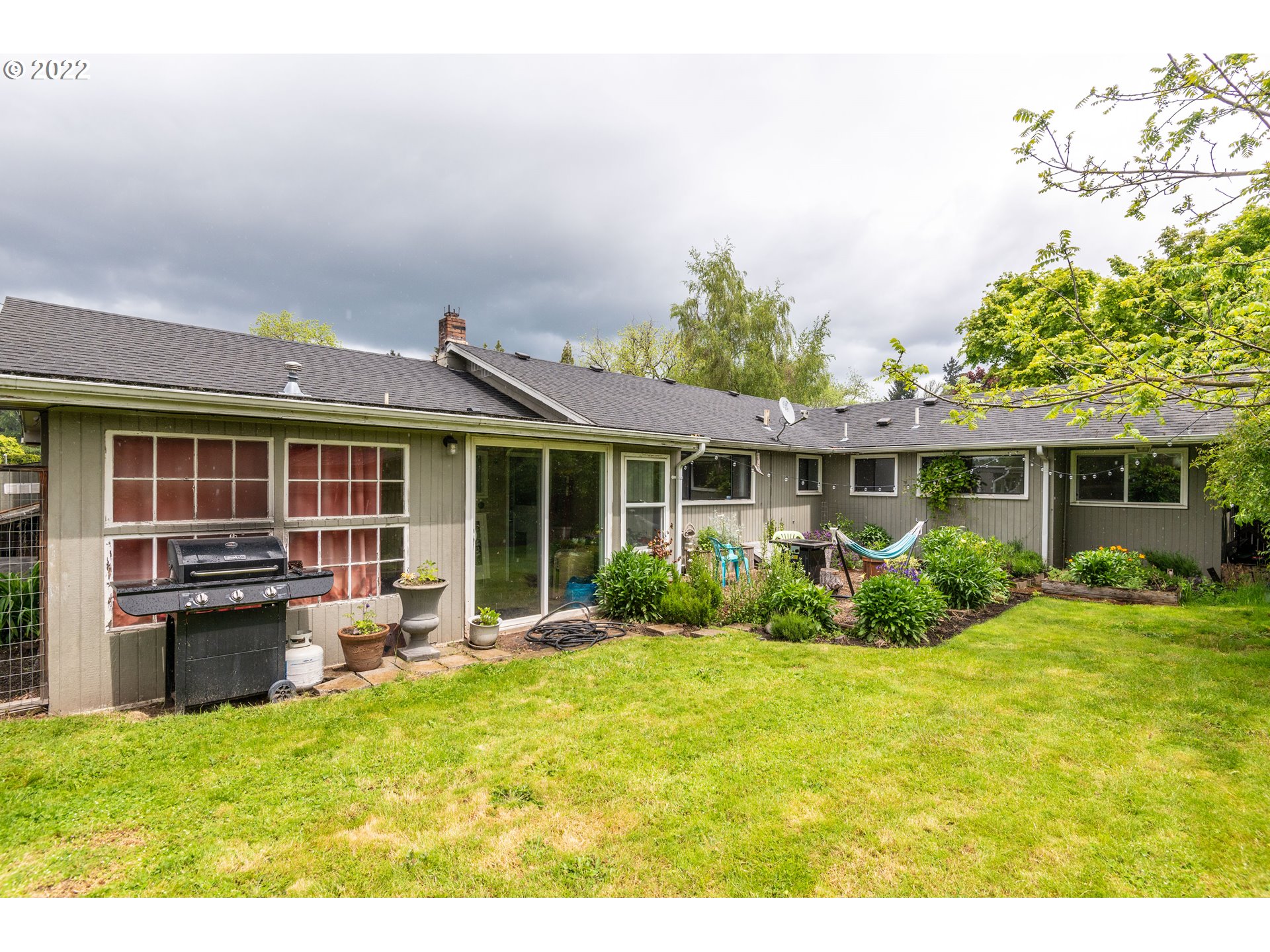 2390 Frontier Drive Eugene, OR 97401 - Photo 23 of 32 a view of a house with a backyard and garden