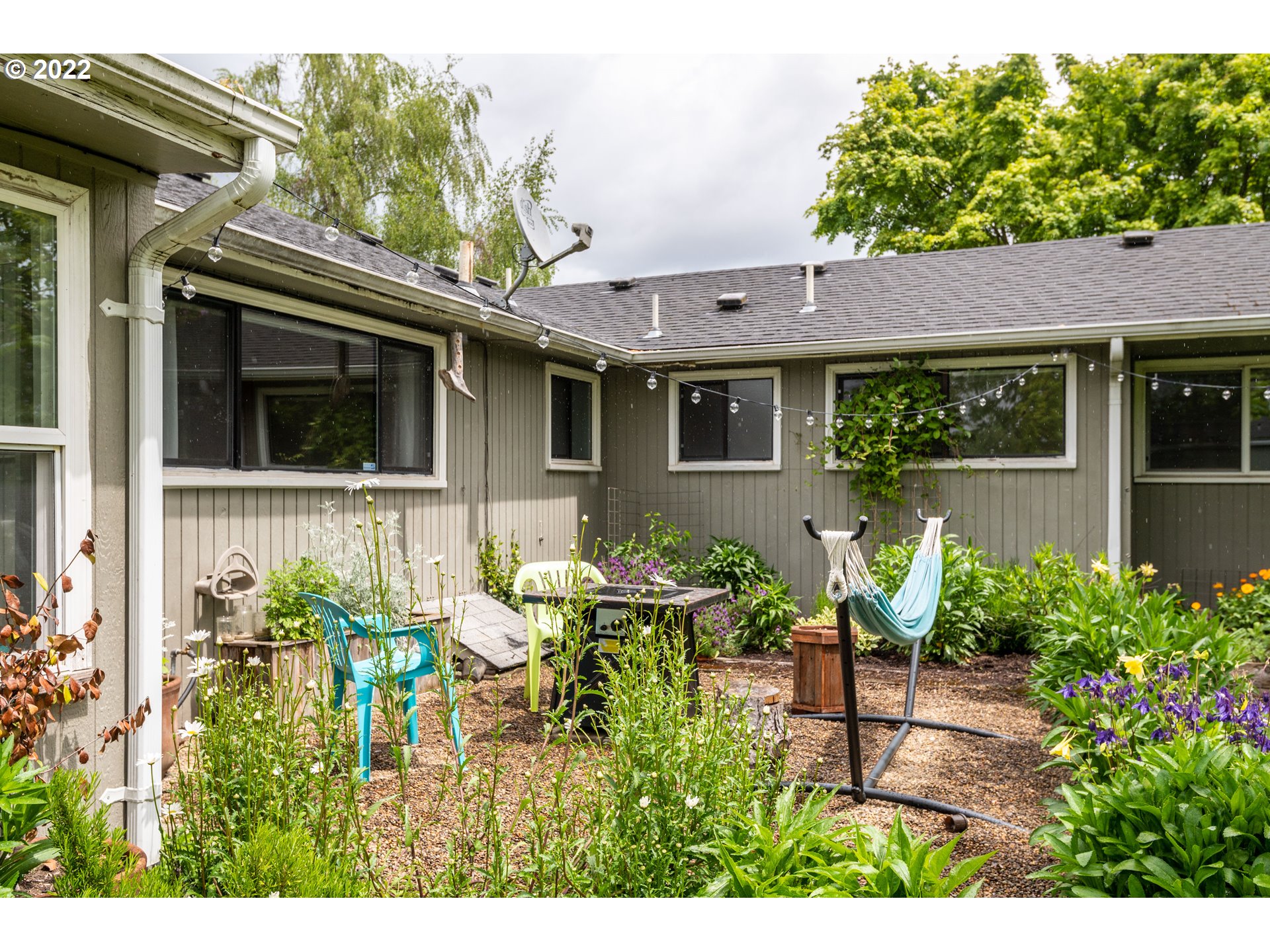 2390 Frontier Drive Eugene, OR 97401 - Photo 24 of 32 a view of a backyard with table and chairs and potted plants
