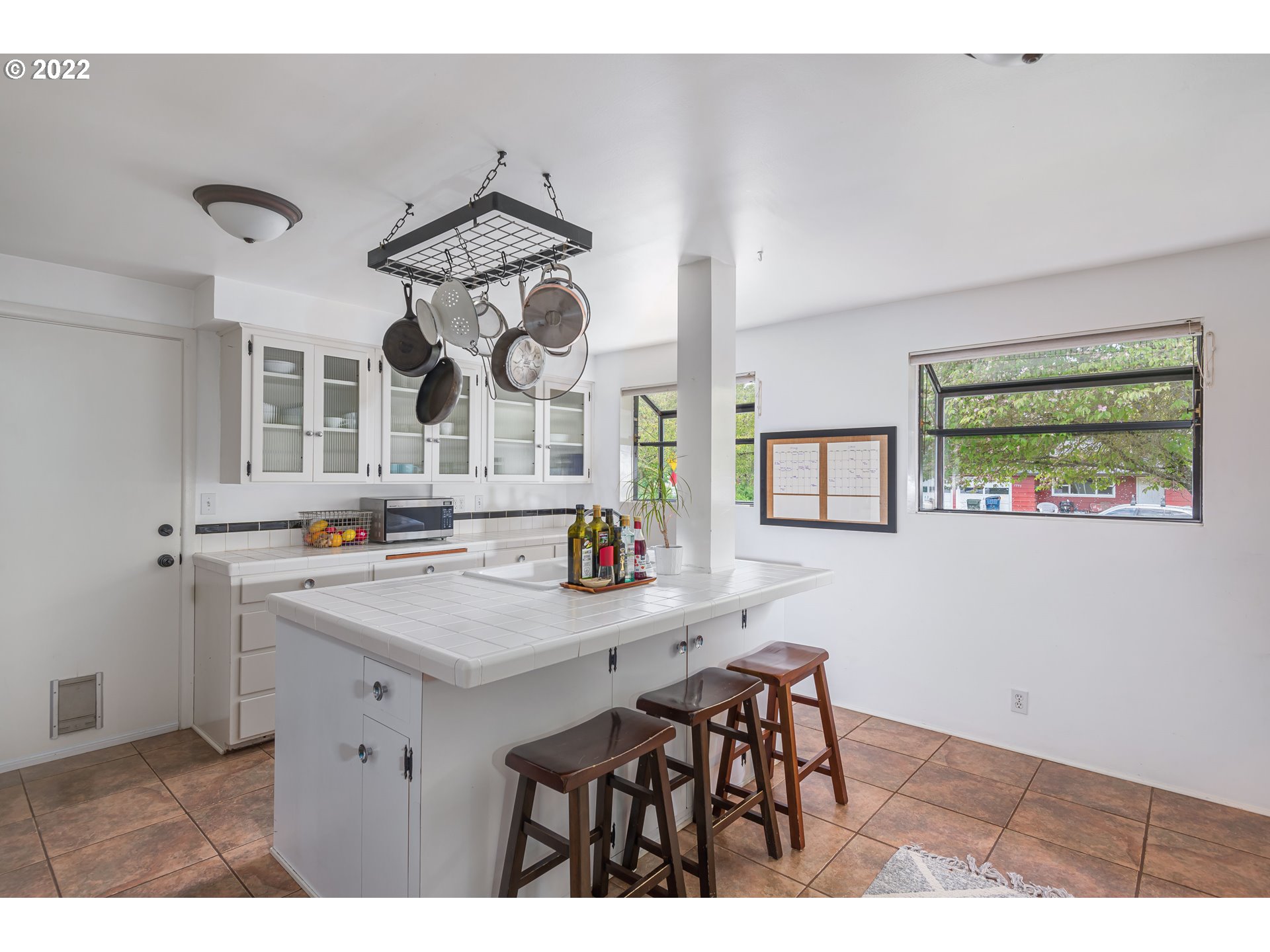 2390 Frontier Drive Eugene, OR 97401 - Photo 7 of 32 a view of kitchen island with furniture and wooden floor