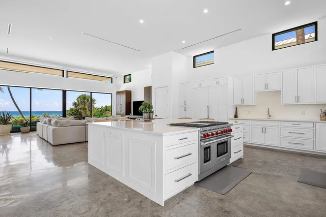 a kitchen with stainless steel appliances a stove a sink and a refrigerator