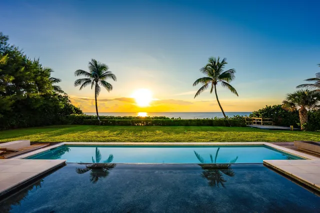 a view of a swimming pool and lounge chair