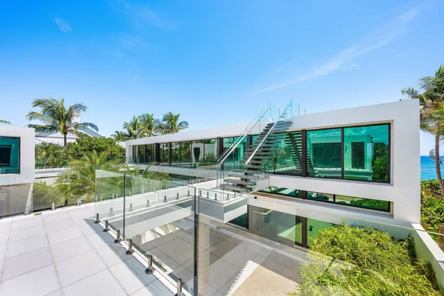 a view of a house with backyard outdoor seating and hardwood