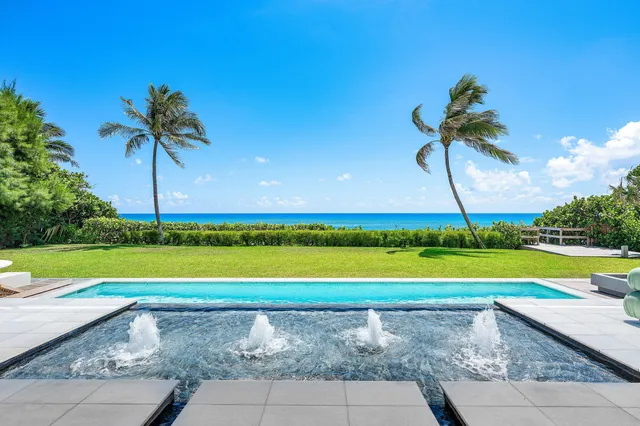 a view of a golf course with a swimming pool