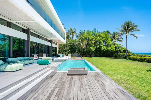 a view of swimming pool with lounge chair