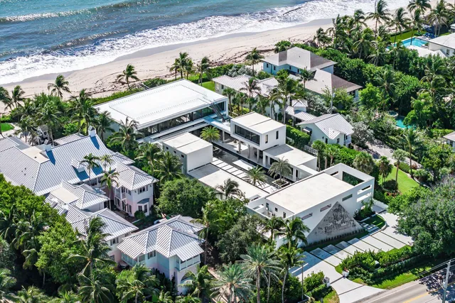 an aerial view of a house with outdoor space