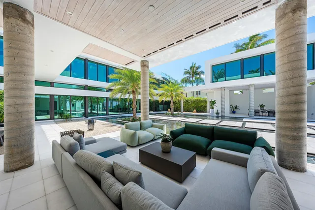 a view of a patio with couches and a table and chairs