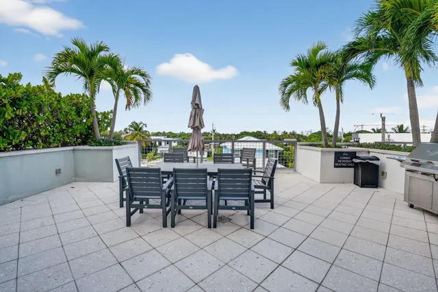 a view of a kitchen with a table and chairs