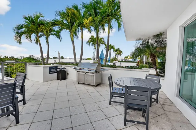 a view of a kitchen with kitchen island dining table and chairs