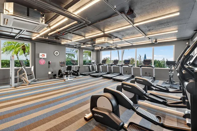 a view of gym room with gym equipment