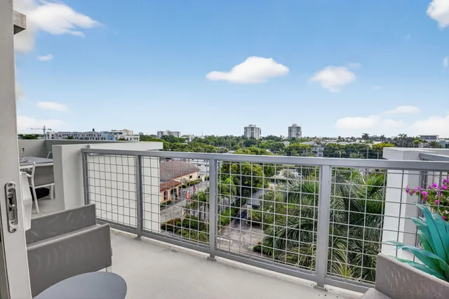 a view of a balcony with city view