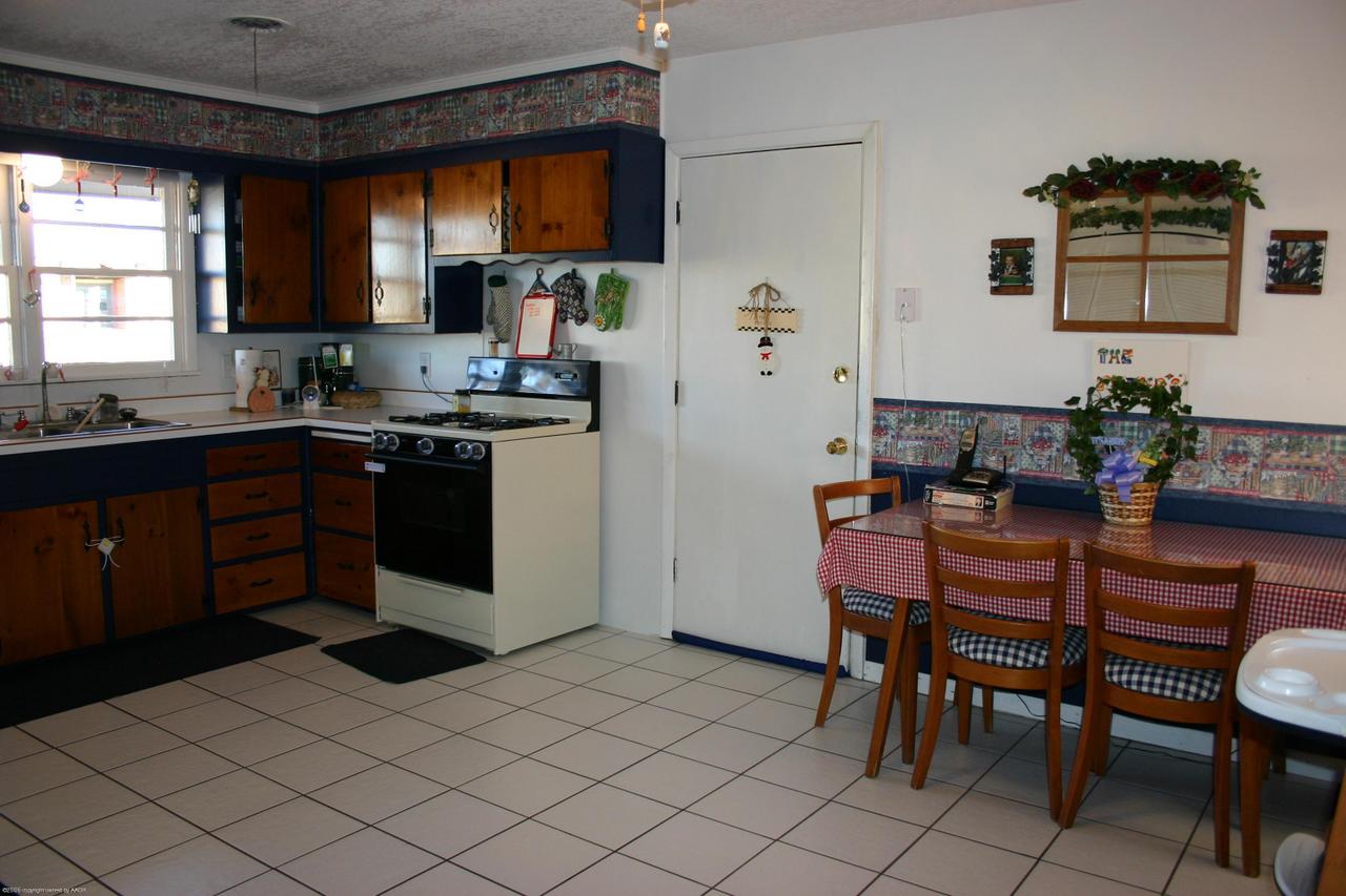 4618 South Rusk Street Amarillo, TX 79110 - Photo 3 of 10 a kitchen with a sink and cabinets