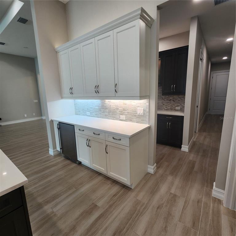 512 Blue Shell Loop Sarasota, FL 34240 - Photo 13 of 44 a kitchen with a sink and cabinets