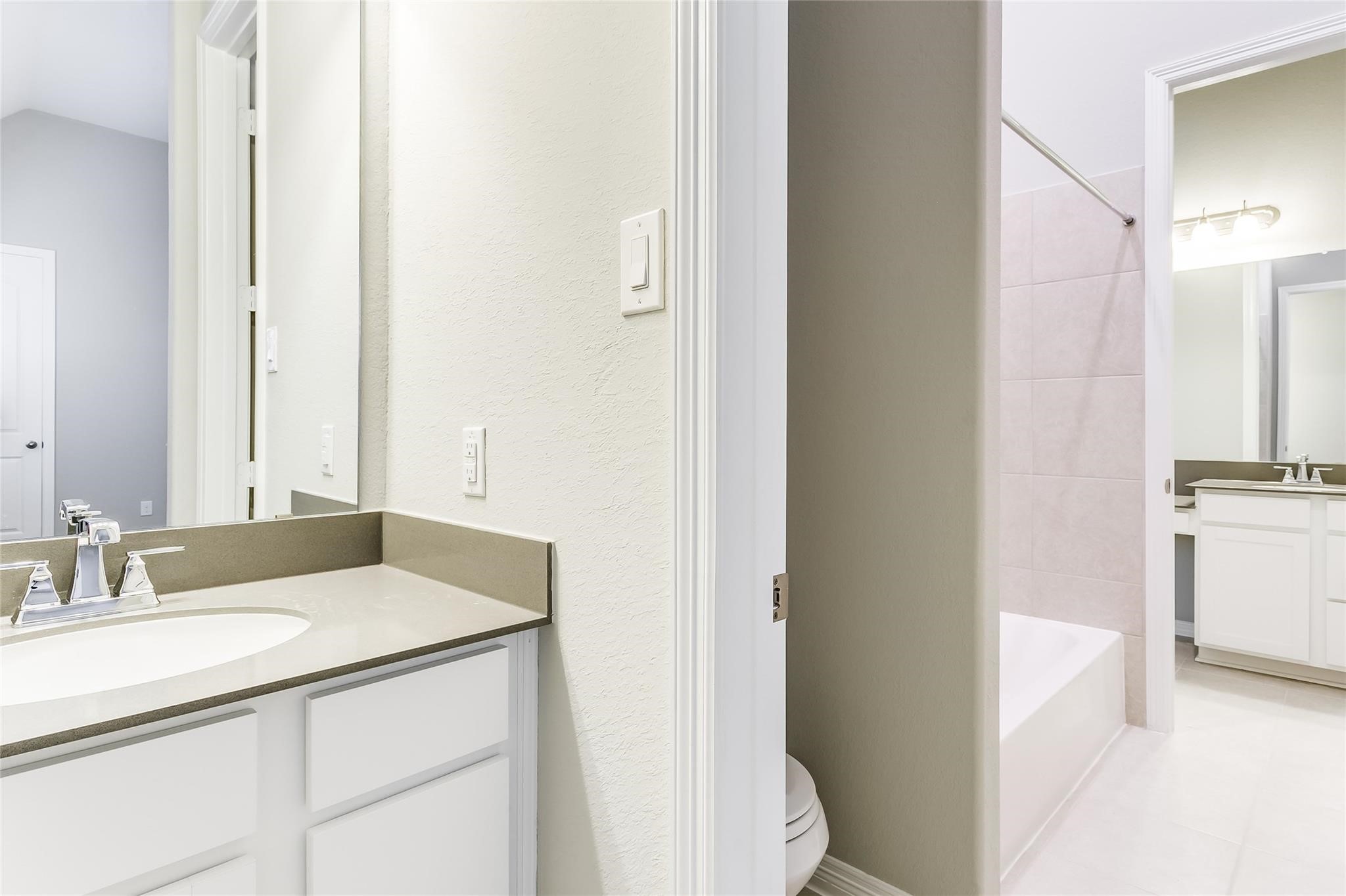 4227 Carol Ridge Drive Sugar Land, TX 77479 - Photo 26 of 35 a bathroom with a sink and a mirror