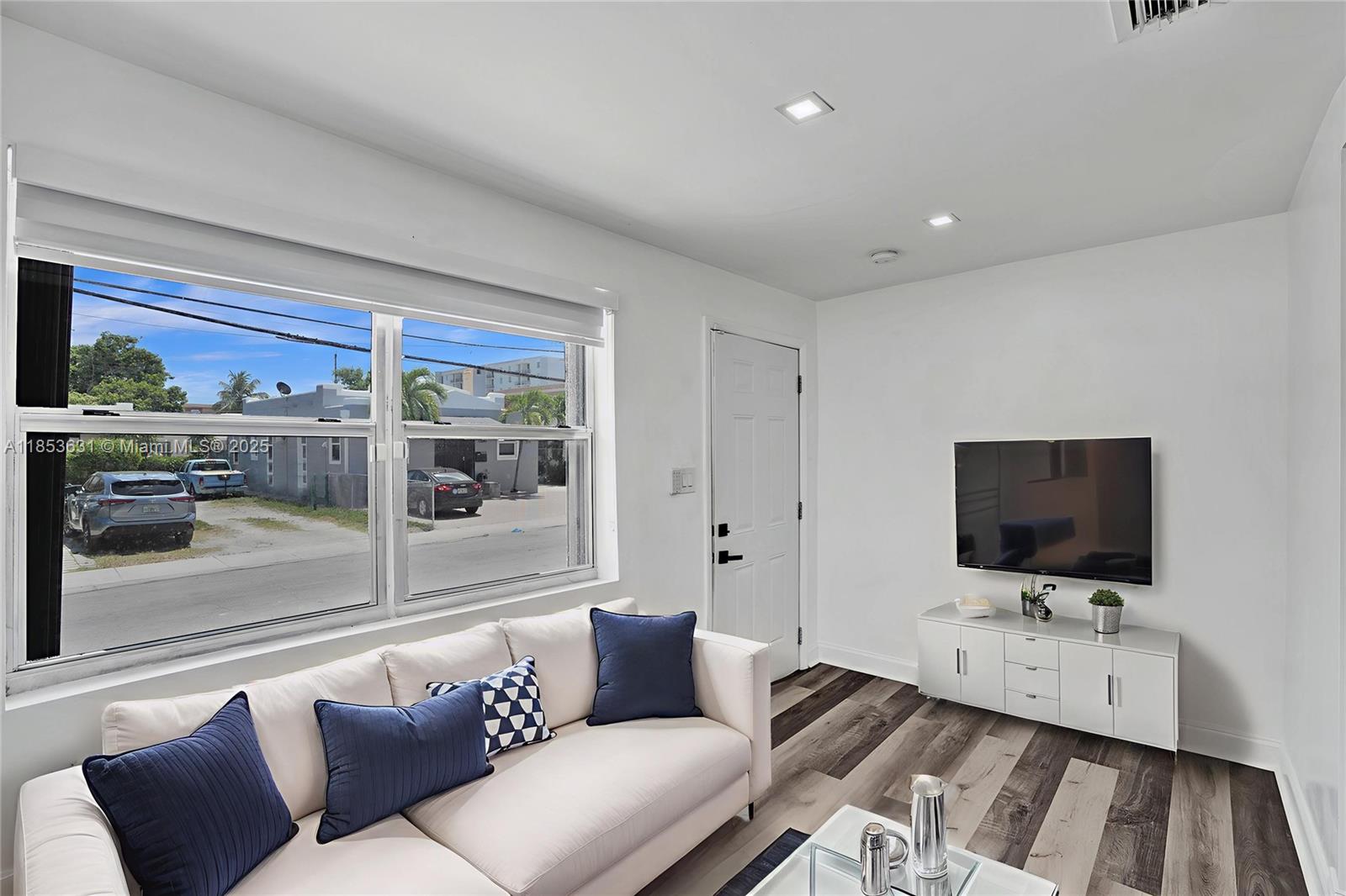 2135 Southwest 4th Street Miami, FL 33135 - Photo 11 of 28 a living room with furniture and a flat screen tv