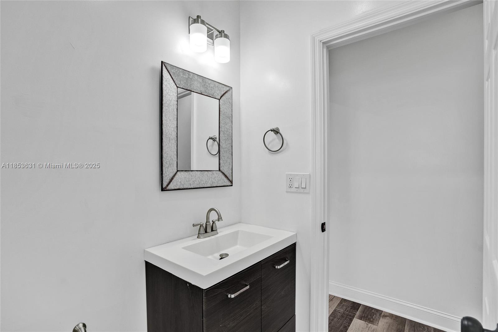 2135 Southwest 4th Street Miami, FL 33135 - Photo 13 of 28 a bathroom with a sink and a mirror