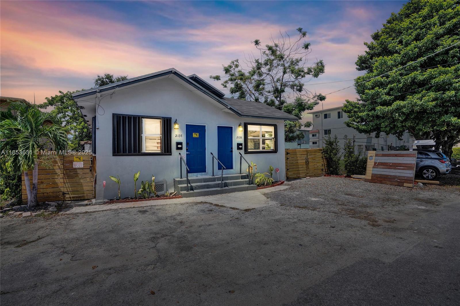 2135 Southwest 4th Street Miami, FL 33135 - Photo 2 of 28 a front view of a house with a garden