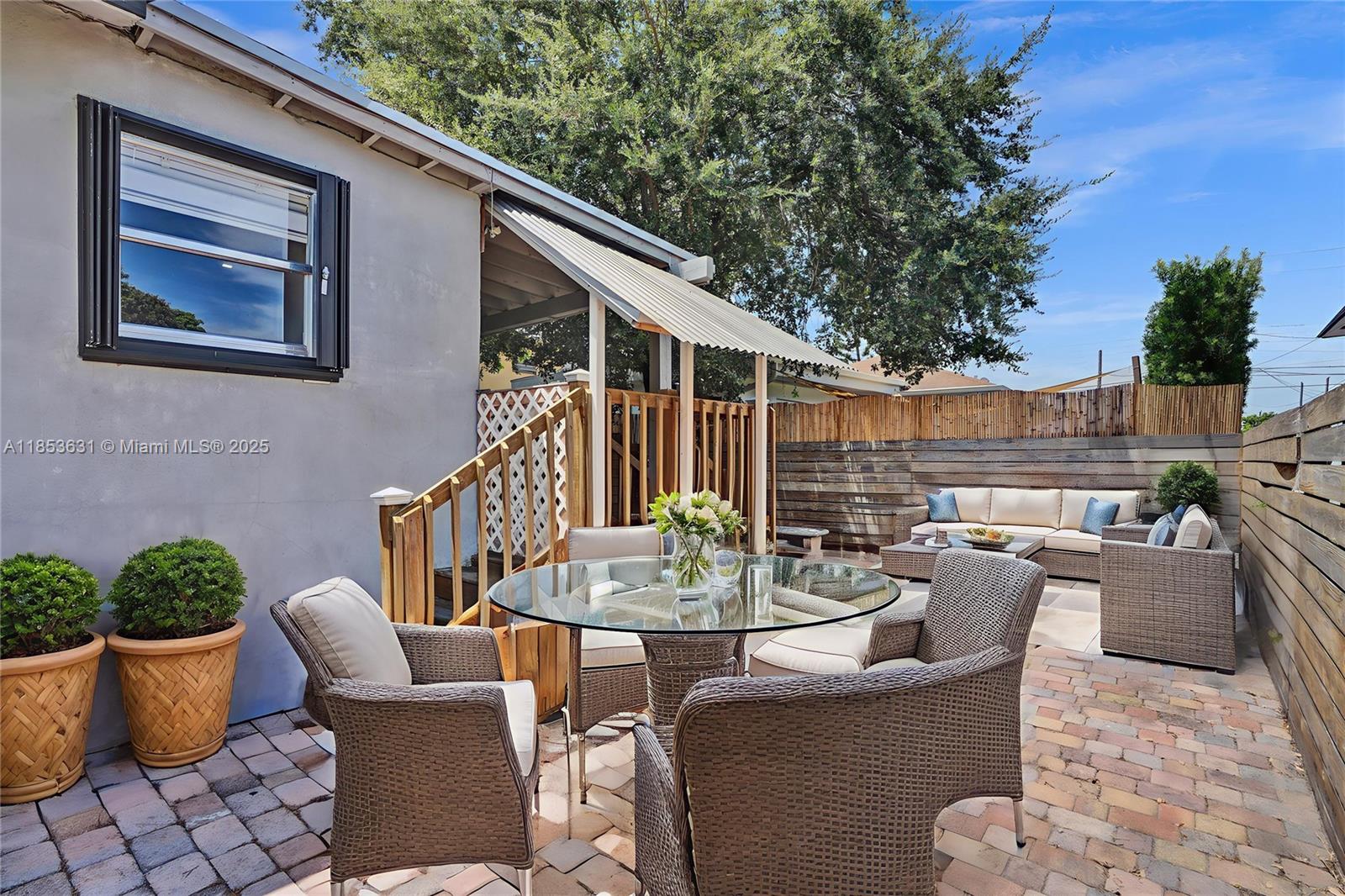 2135 Southwest 4th Street Miami, FL 33135 - Photo 6 of 28 a view of a patio with couches chairs and potted plants