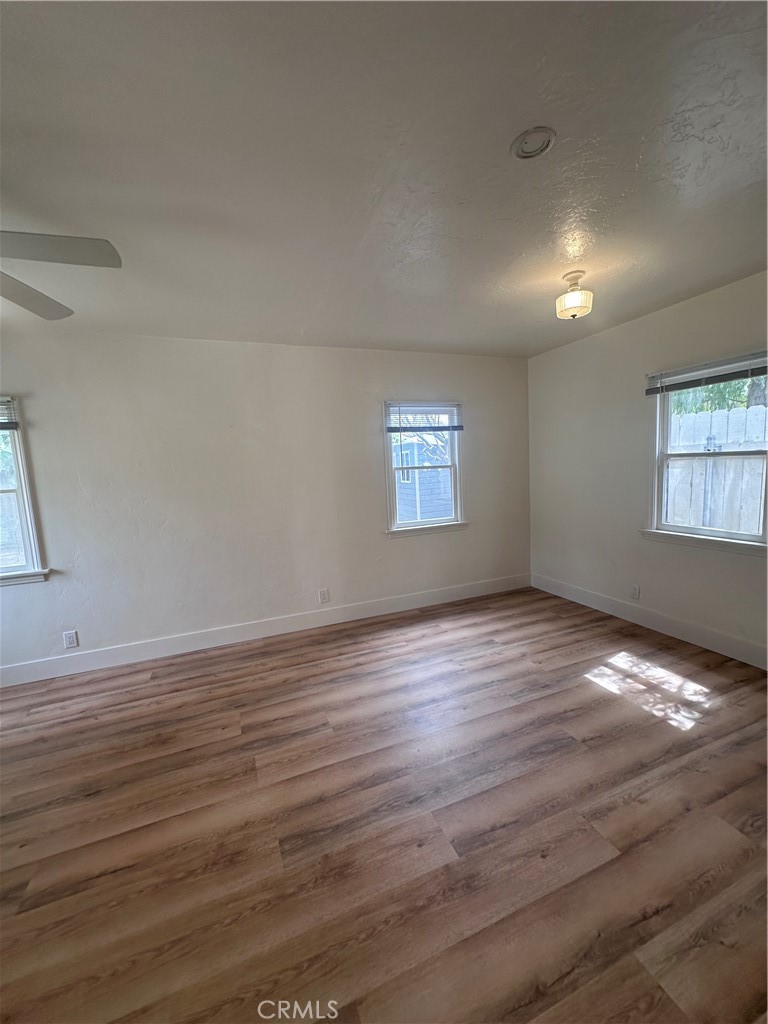 243 North Grand Street, Unit 1/2 Orange, CA 92866 - Photo 21 of 29 a view of an empty room with wooden floor and a window