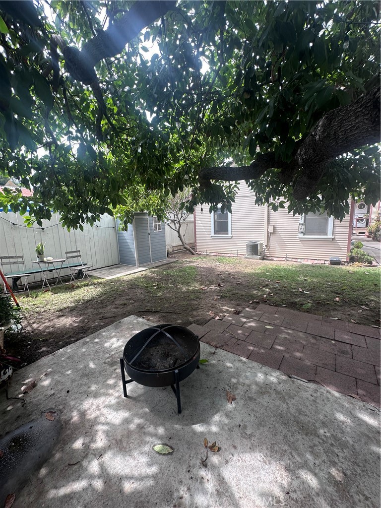 243 North Grand Street, Unit 1/2 Orange, CA 92866 - Photo 10 of 29 a backyard of a house with table and chairs