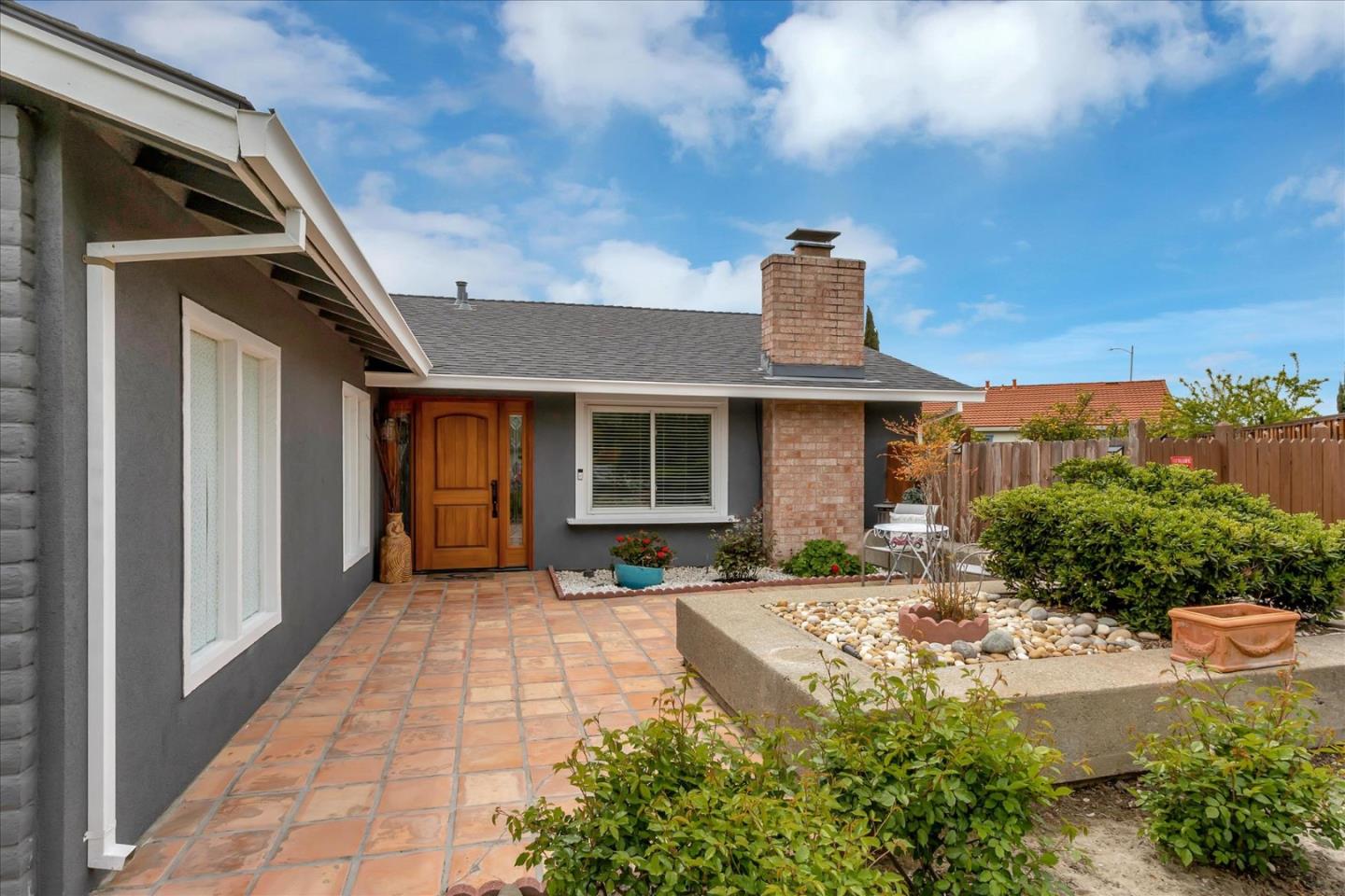 637 Escuela Place Milpitas, CA 95035 - Photo 2 of 49 a front view of a house with garden
