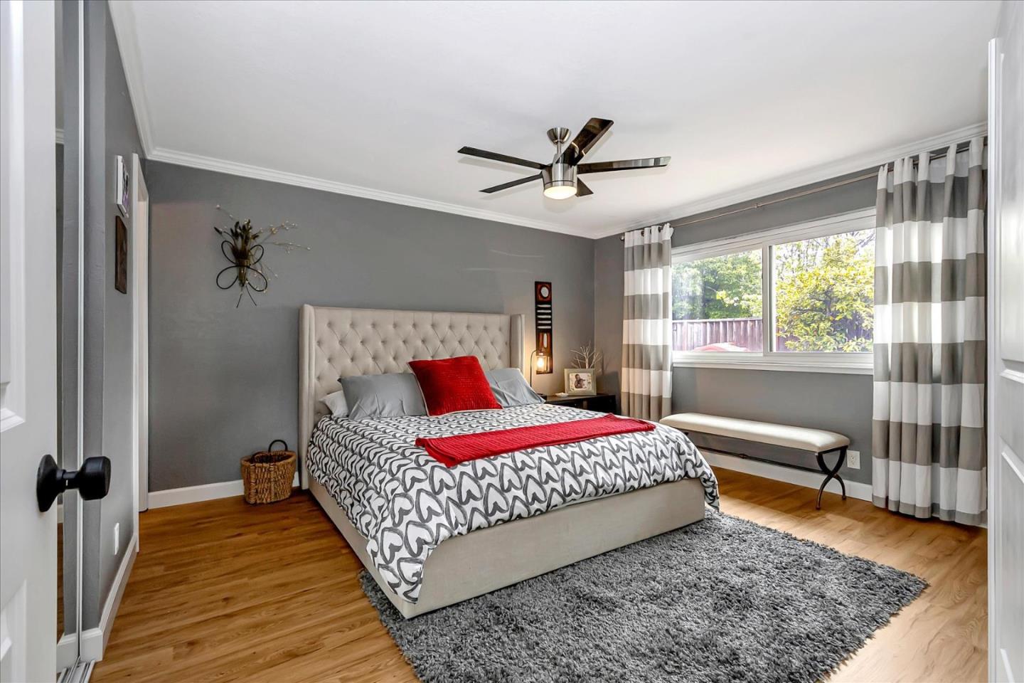 637 Escuela Place Milpitas, CA 95035 - Photo 23 of 49 a bedroom with a bed and wooden floor