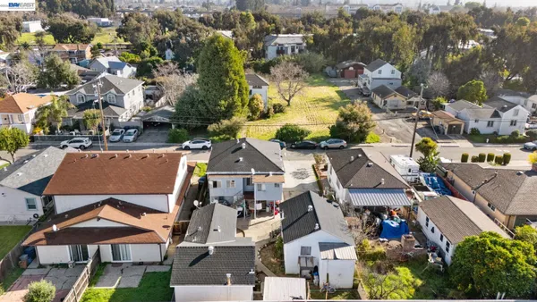 an aerial view of residential house with outdoor space and swimming pool